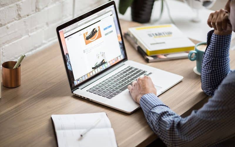 Audit report being reviewed on a laptop