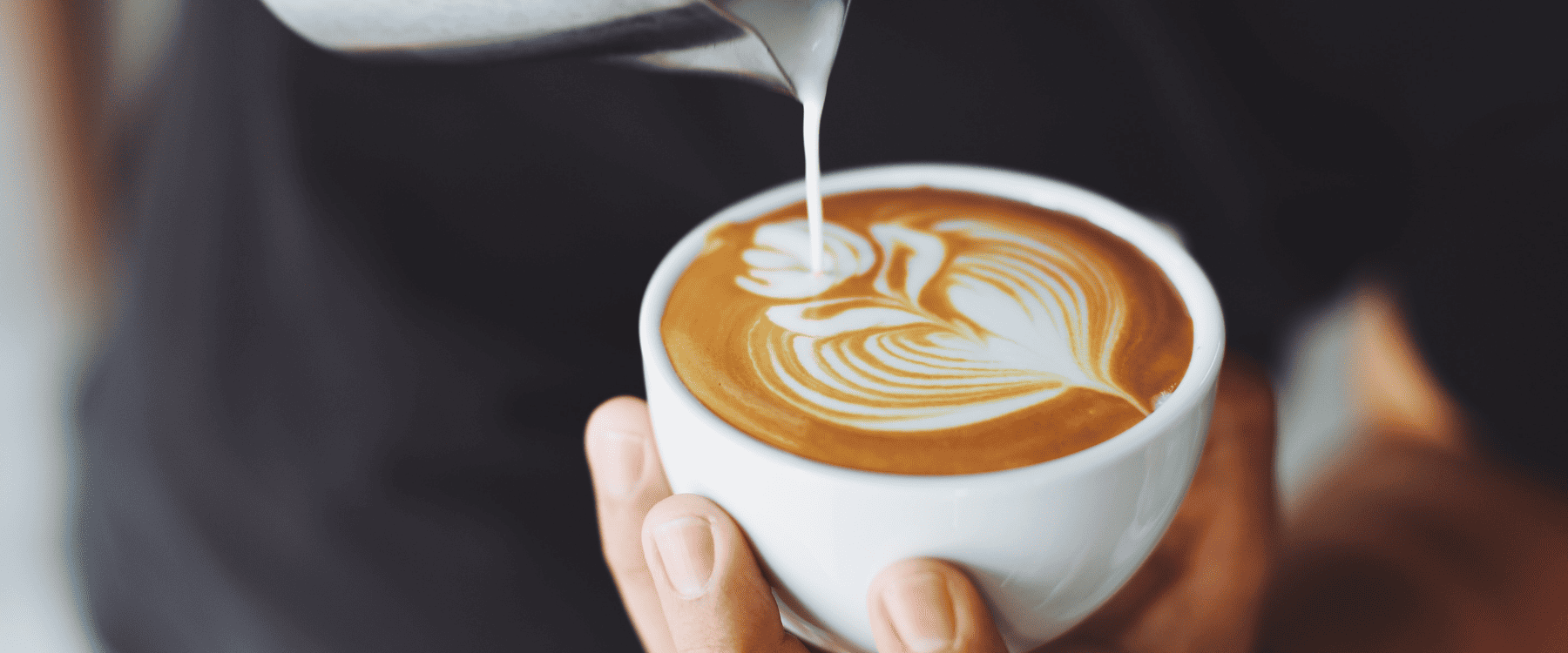 Hospitality worker preparing coffee during practical training