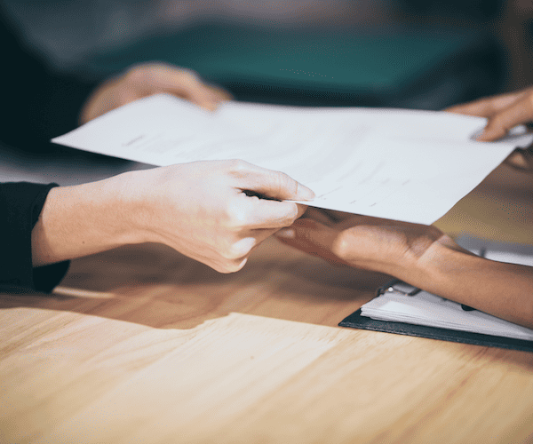 Employer and student reviewing training funding paperwork