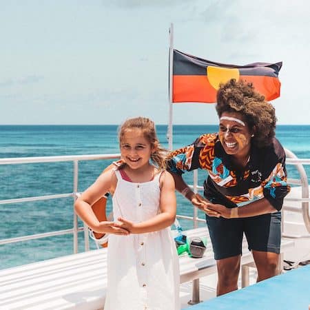 Tourism student learning practical visitor experience skills in Tropical North Queensland.