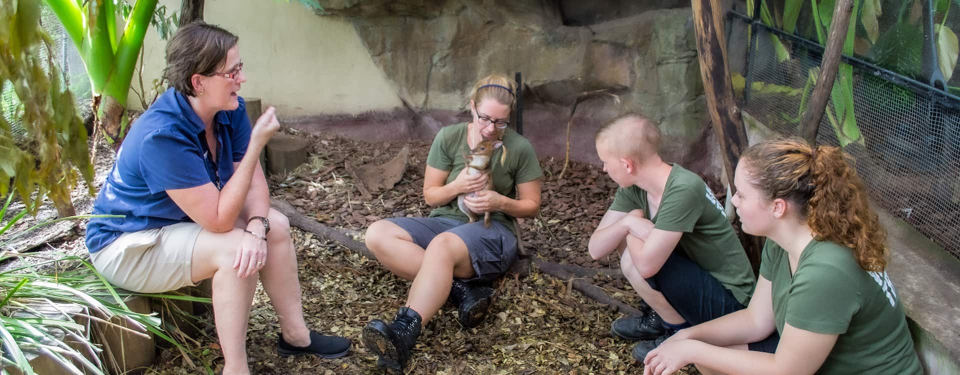 Trainer working with students during practical wildlife training in Cairns.